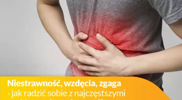 Osoba trzyma się za brzuch, odczuwając ból brzucha po jedzeniu. Czerwony obszar na brzuchu symbolizuje dyskomfort.